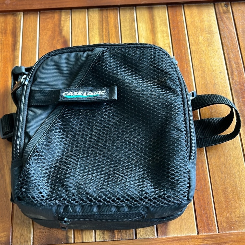 Vintage Case Logic Portable CD/gamer carrying case with strap.​